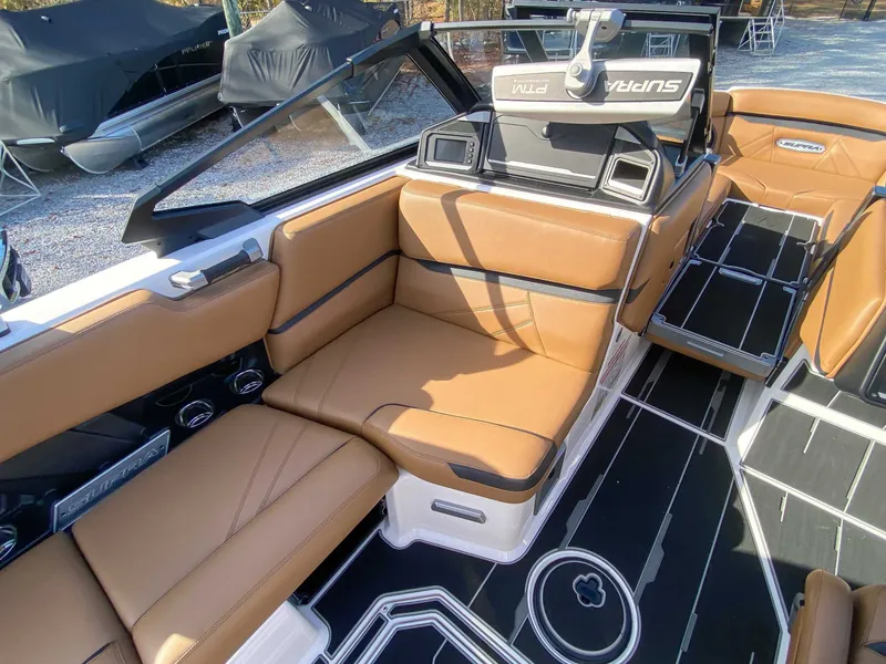 Slide: The Image of 2024 Supra SL interior with brown leather seating. - 17