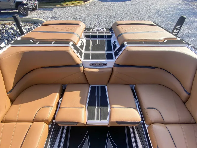 Slide: The Image of 2024 Supra SL boat with luxurious brown leather seating. - 21