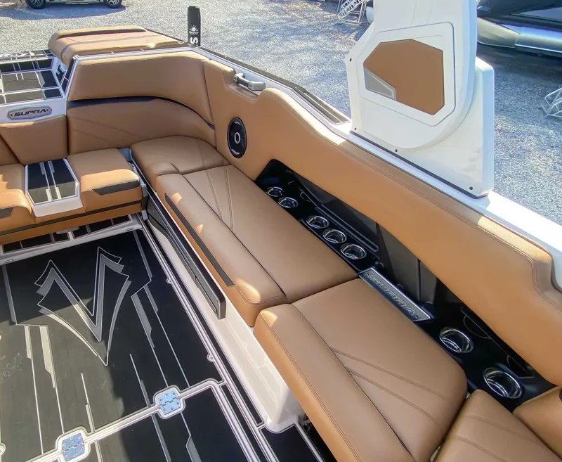 Slide: The Image of 2024 Supra SL interior with brown leather seating. - 22