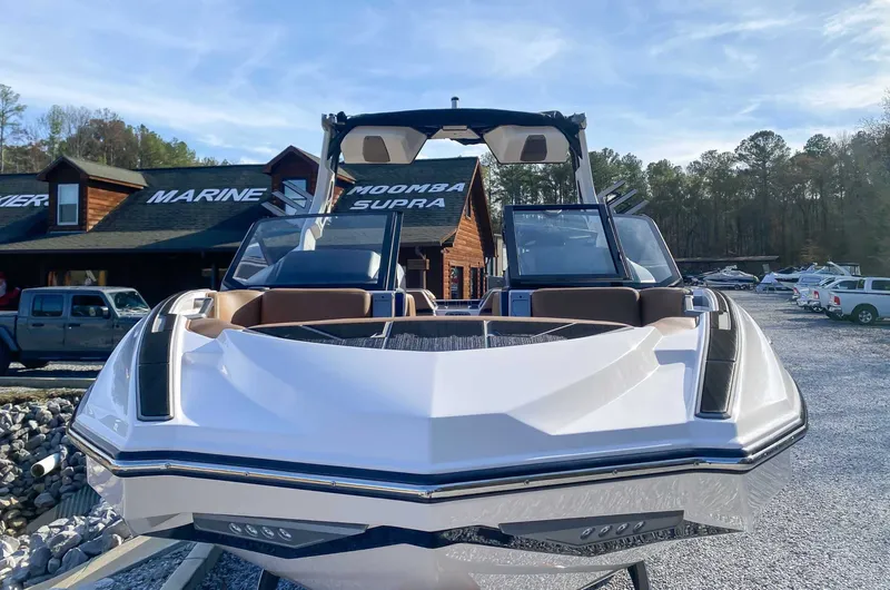 Slide: The Image of 2024 Supra SL boat in front of a marine shop. - 4