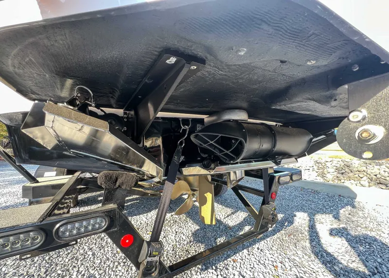 Slide: The Image of Underside of a 2024 MasterCraft X22 boat on a trailer. - 10