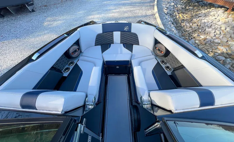 Slide: The Image of 2024 MasterCraft X22 boat interior with luxurious seating. - 17