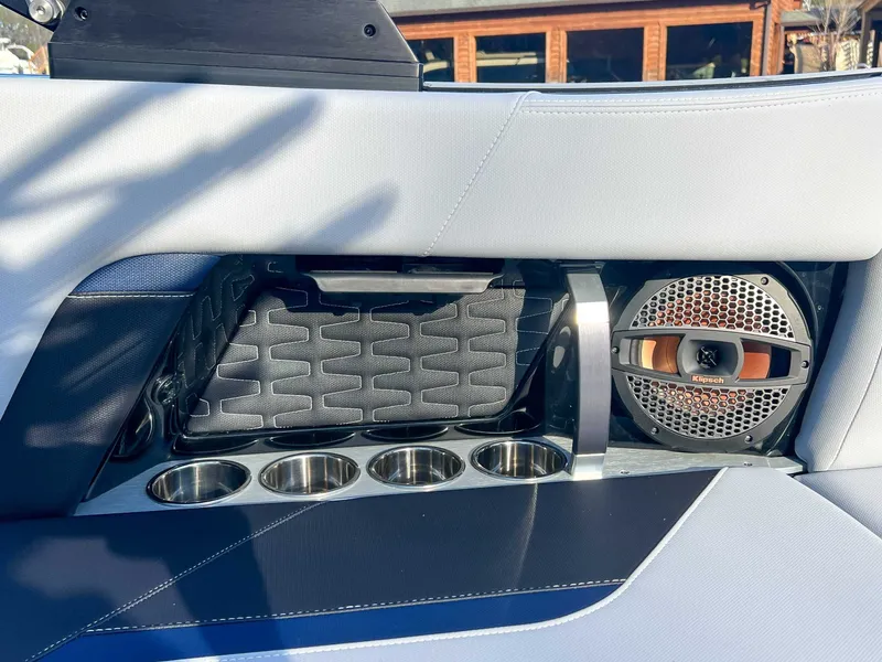 Slide: The Image of Interior of 2024 MasterCraft X22 with speaker and cup holders. - 25