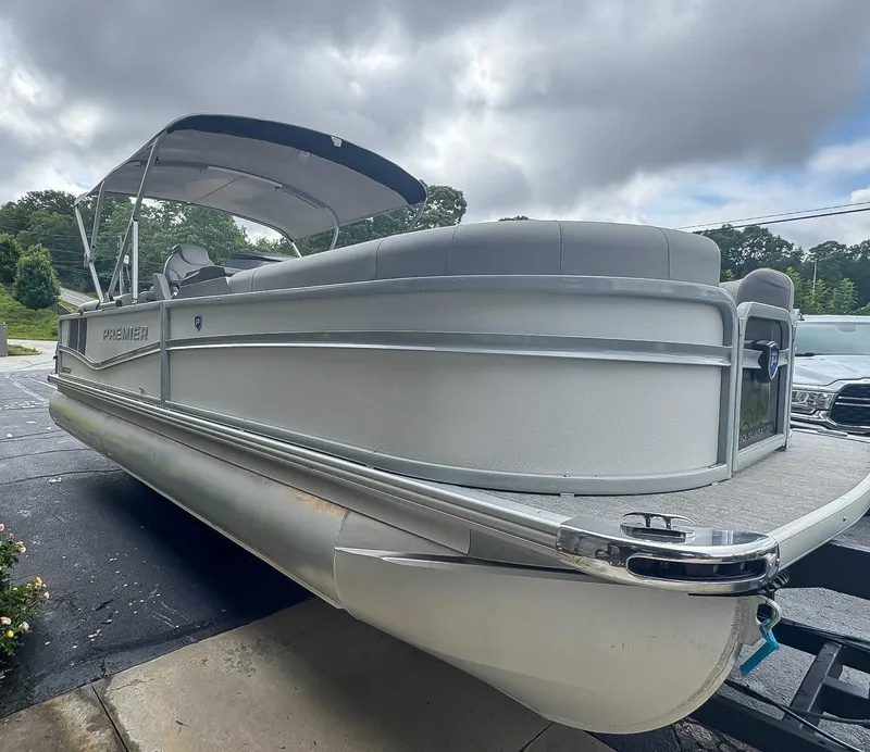 Slide: The Image of 2024 Premier 230 SunSation RF pontoon boat on a trailer. - 5