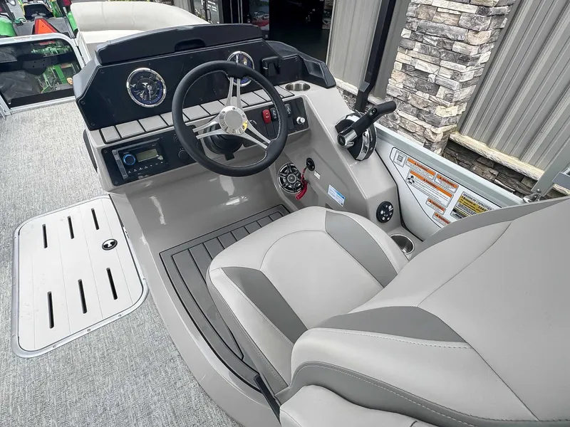 Slide: The Image of Interior of 2024 Premier 230 SunSation RF boat, modern helm station. - 9