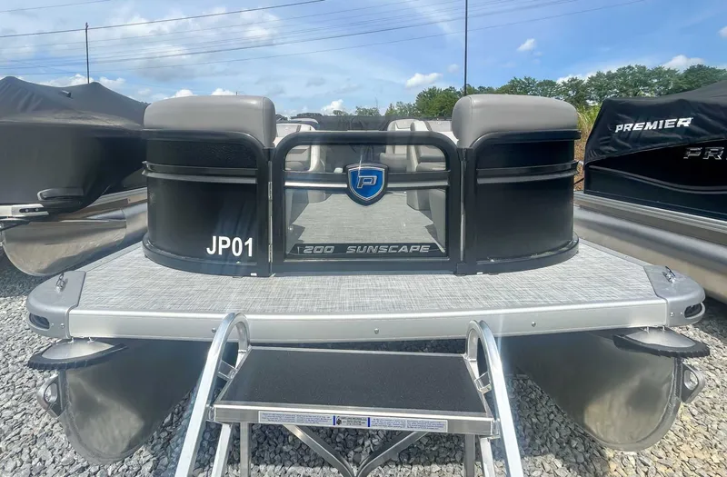Slide: The Image of Premier 200 Sunscape RF 2025 pontoon boat on gravel lot. - 4