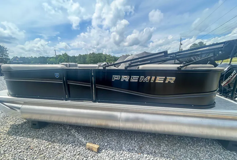 Slide: The Image of 2025 Premier 200 Sunscape RF pontoon boat on gravel surface. - 5