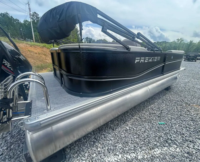 Slide: The Image of 2025 Premier 200 Sunscape RF pontoon boat on gravel surface. - 7