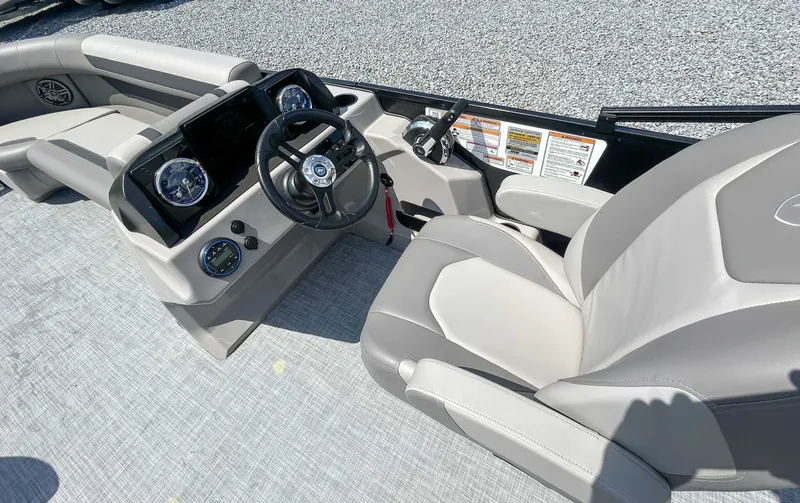 Slide: The Image of 2025 Premier 220 SUNSCAPE RL boat interior with steering wheel. - 15