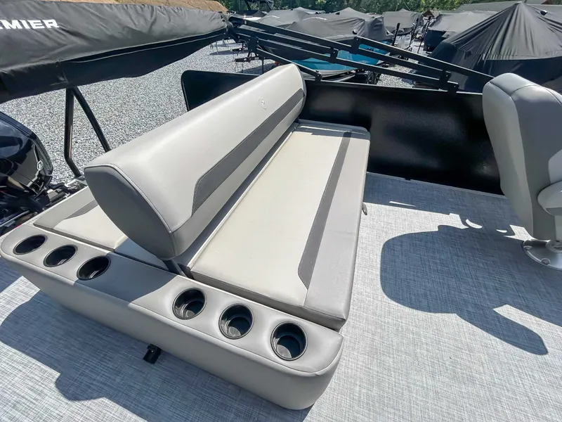 Slide: The Image of Premier 220 SUNSCAPE RL 2025 boat seat with cup holders. - 17
