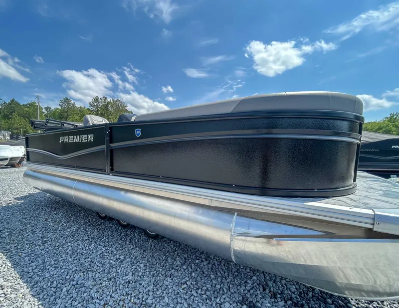 Slide: The Image of 2025 Premier 220 SUNSCAPE RL pontoon boat on gravel lot. - 3