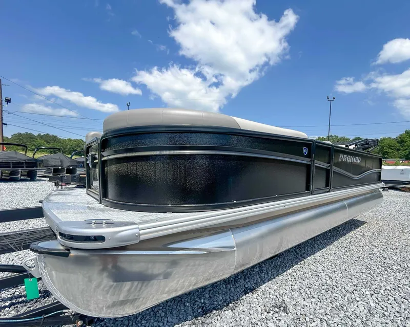 Slide: The Image of 2025 Premier 220 SUNSCAPE RL pontoon boat on gravel lot. - 5