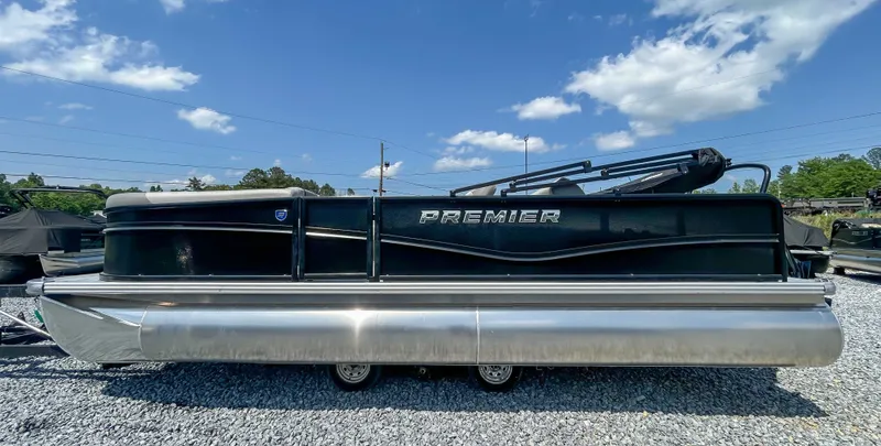 Slide: The Image of 2025 Premier 220 SUNSCAPE RL pontoon boat on gravel surface. - 6