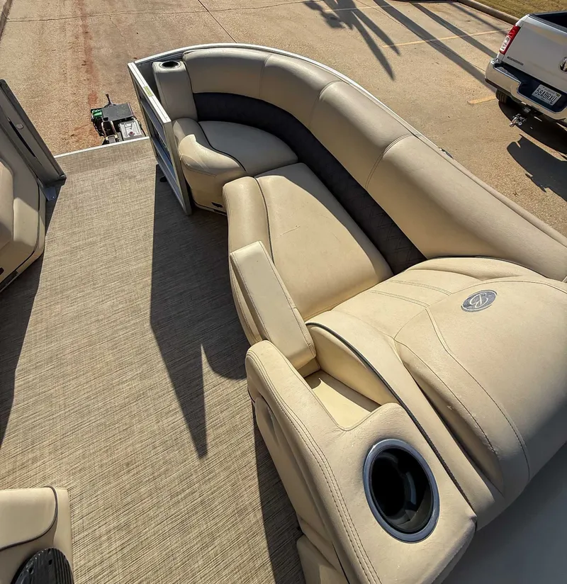 Slide: The Image of Interior of a 2018 Barletta L23UC pontoon boat with beige seating. - 12