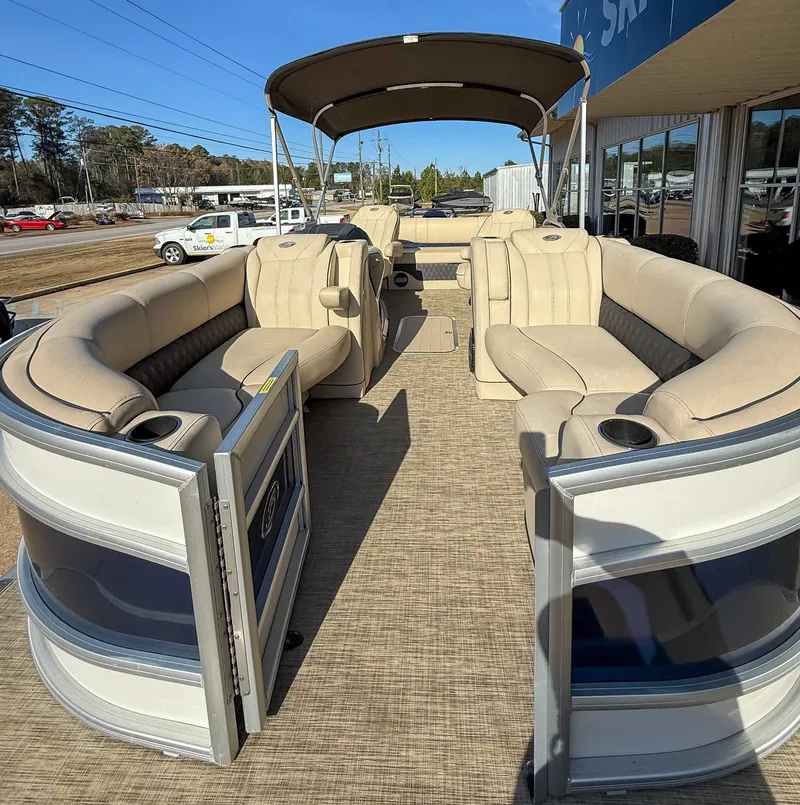 Slide: The Image of 2018 Barletta L23UC pontoon boat with beige seating and canopy. - 15