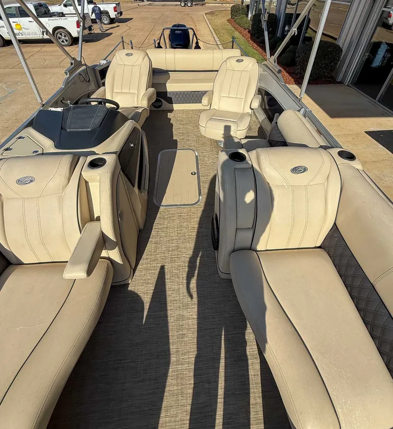 Slide: The Image of Interior of a 2018 Barletta L23UC pontoon boat with beige leather seating. - 16
