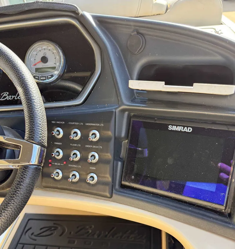 Slide: The Image of Dashboard of a 2018 Barletta L23UC with Simrad display. - 18