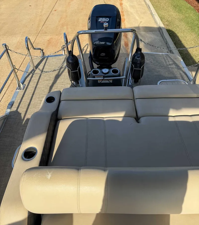 Slide: The Image of Rear view of a 2018 Barletta L23UC boat with engine. - 19
