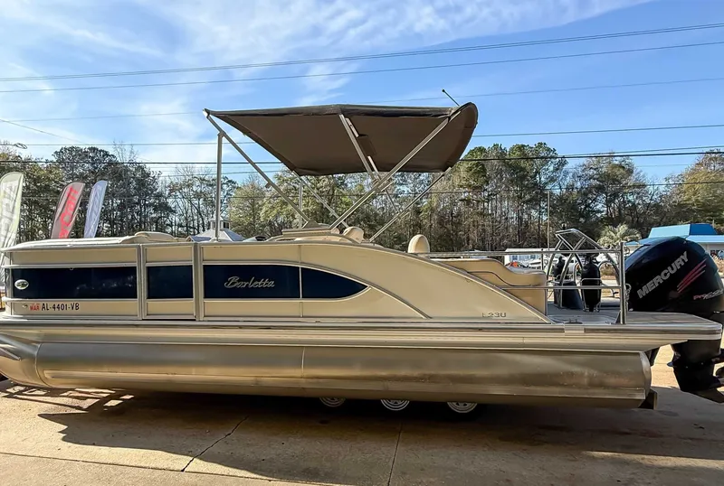 Slide: The Image of 2018 Barletta L23UC pontoon boat with canopy and Mercury engine. - 3