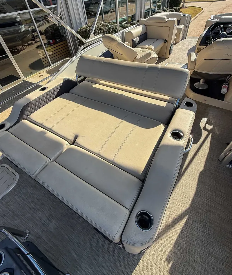 Slide: The Image of Interior of a 2018 Barletta L23UC pontoon boat with beige seating. - 7