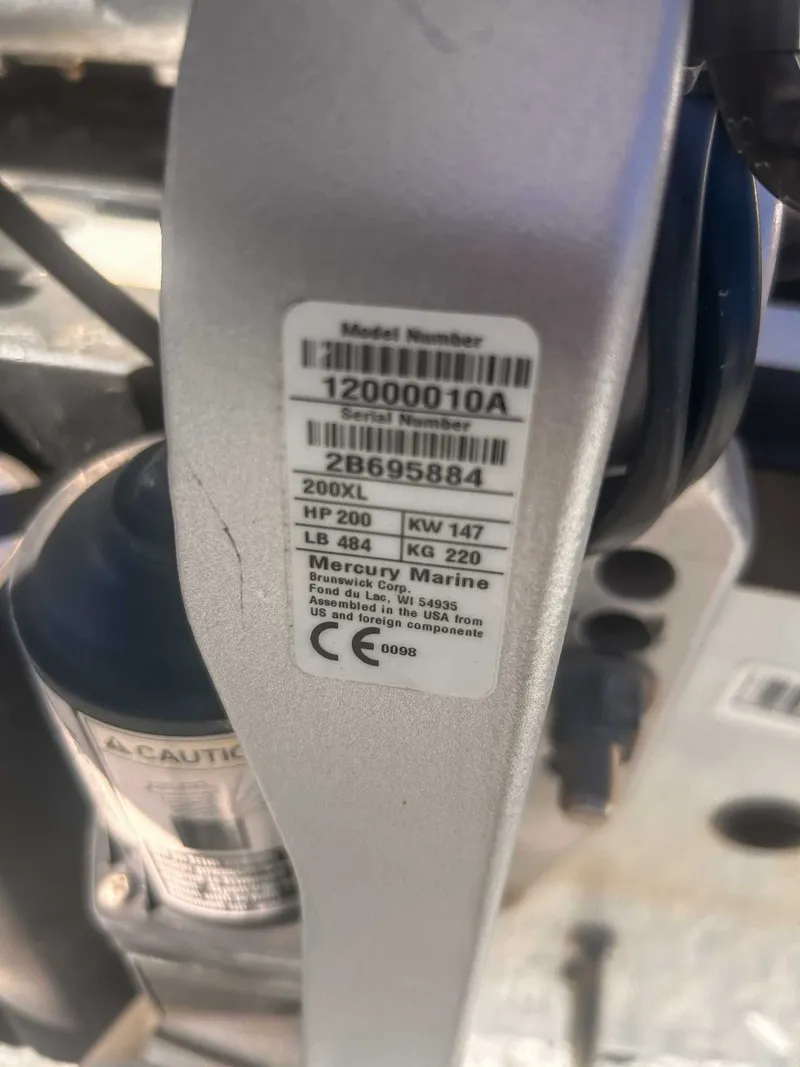 Slide: The Image of Close-up of Mercury Marine engine label with model and serial number. - 23