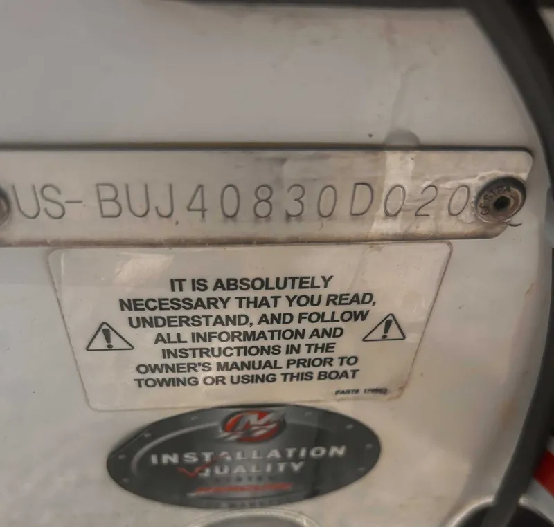Slide: The Image of Warning label and serial number on a 2020 Tahoe 2150 boat. - 24