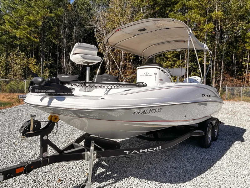 Slide: The Image of 2020 Tahoe 2150 boat parked on trailer outdoors. - 5