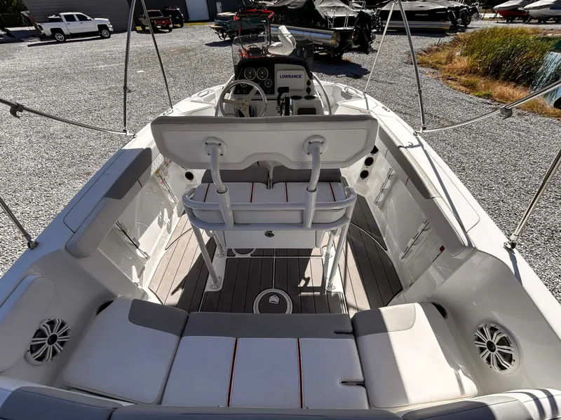 Slide: The Image of Interior view of a 2020 Tahoe 2150 boat on a gravel lot. - 8