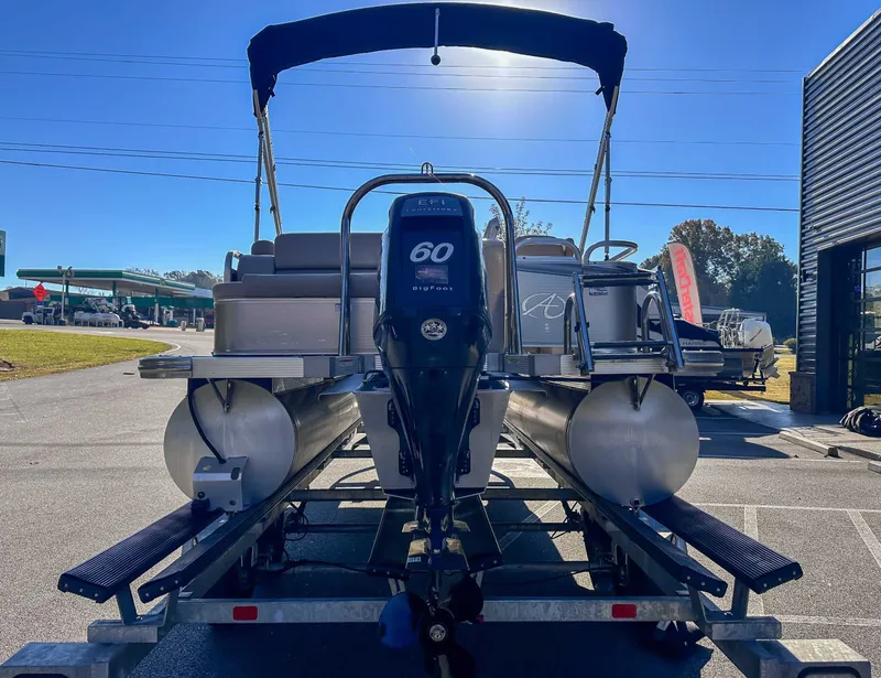 Slide: The Image of 2015 Avalon 2223 LS pontoon boat with 60 HP motor on trailer. - 11