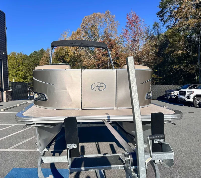 Slide: The Image of 2015 Avalon 2223 LS pontoon boat on trailer outdoors. - 4