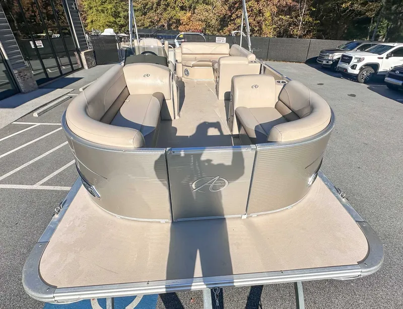 Slide: The Image of Avalon 2223 LS pontoon boat, 2015 model, displayed in parking lot. - 5