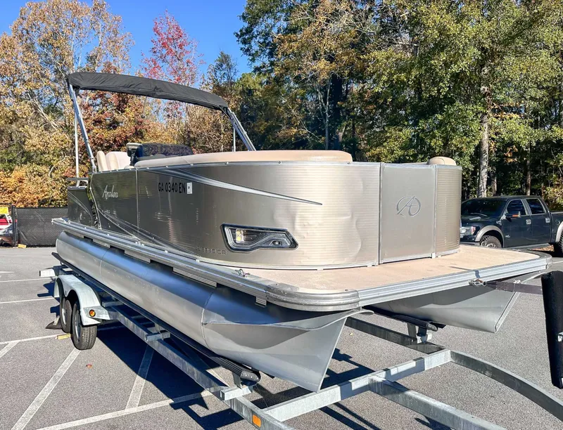 Slide: The Image of 2015 Avalon 2223 LS pontoon boat parked on trailer outdoors. - 7