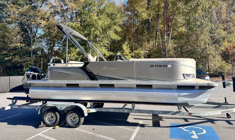 Slide: The Image of 2015 Avalon 2223 LS pontoon boat on trailer outdoors. - 8