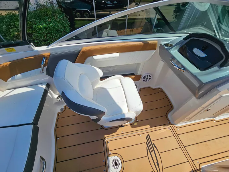 Slide: The Image of Interior of 2023 Chaparral 21 SSi with white seat and wood flooring. - 12