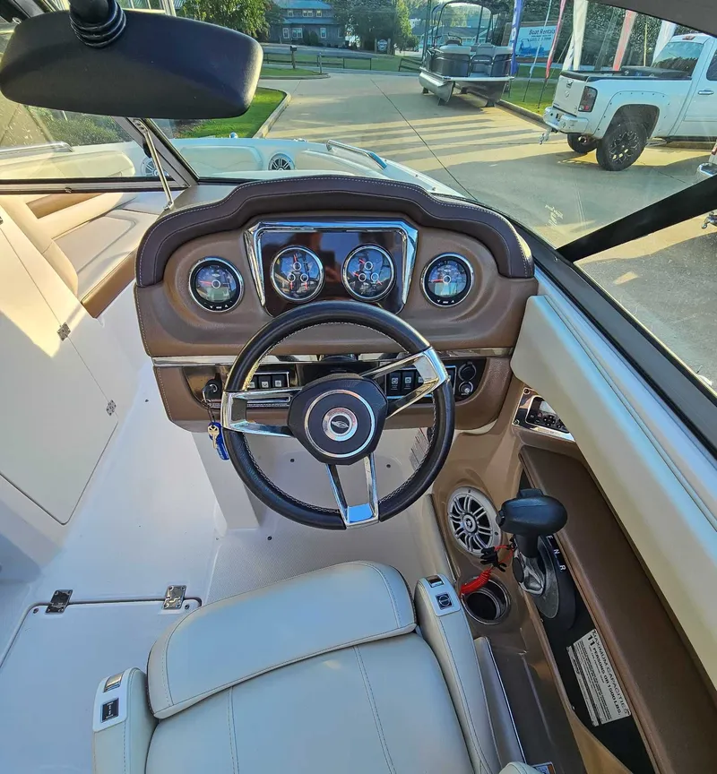 Slide: The Image of 2017 Chaparral 216 SSi boat dashboard and steering wheel. - 14