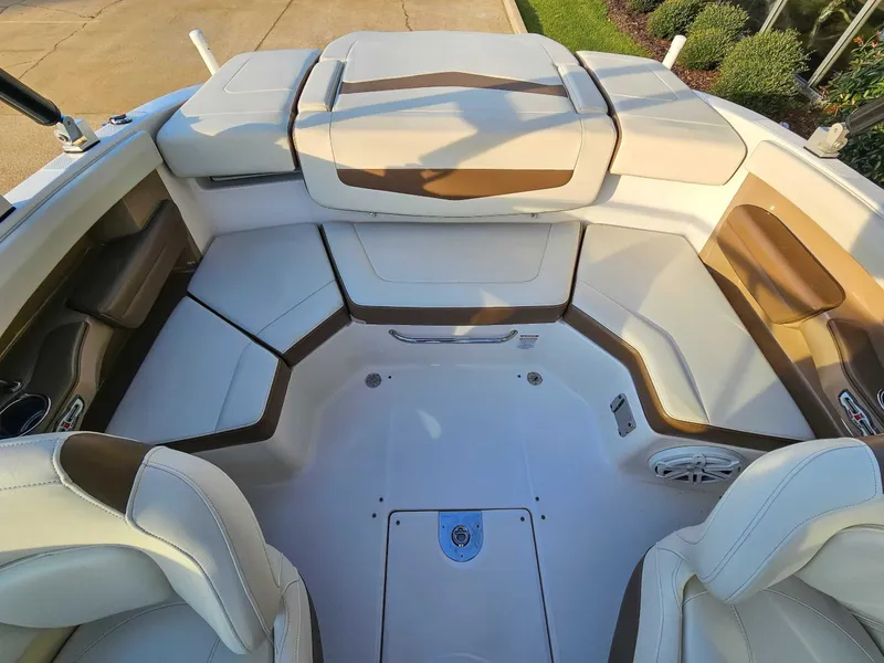 Slide: The Image of Interior of a 2017 Chaparral 216 SSi boat with beige seating. - 15