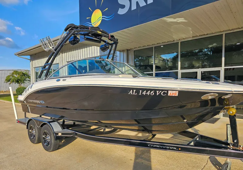 Slide: The Image of 2017 Chaparral 216 SSi boat on trailer in front of building. - 3