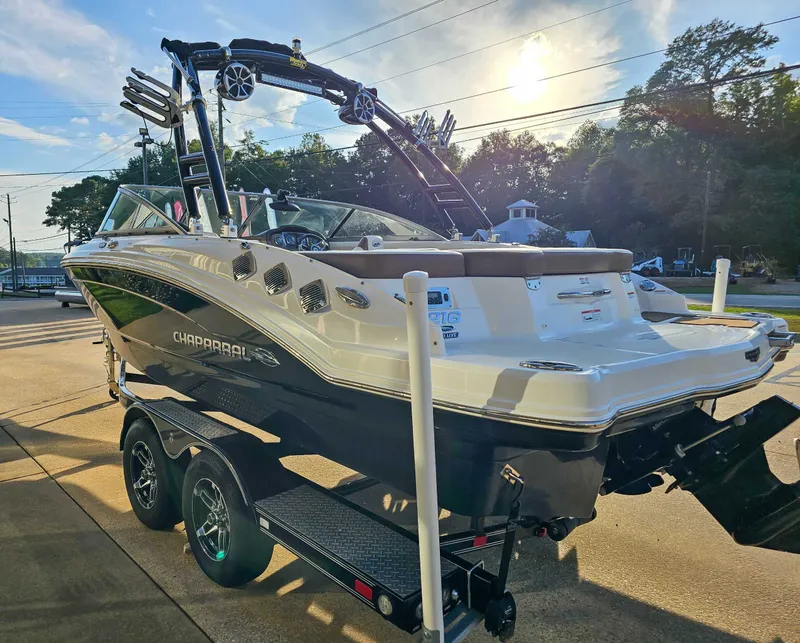 Slide: The Image of 2017 Chaparral 216 SSi boat on trailer at sunset. - 7