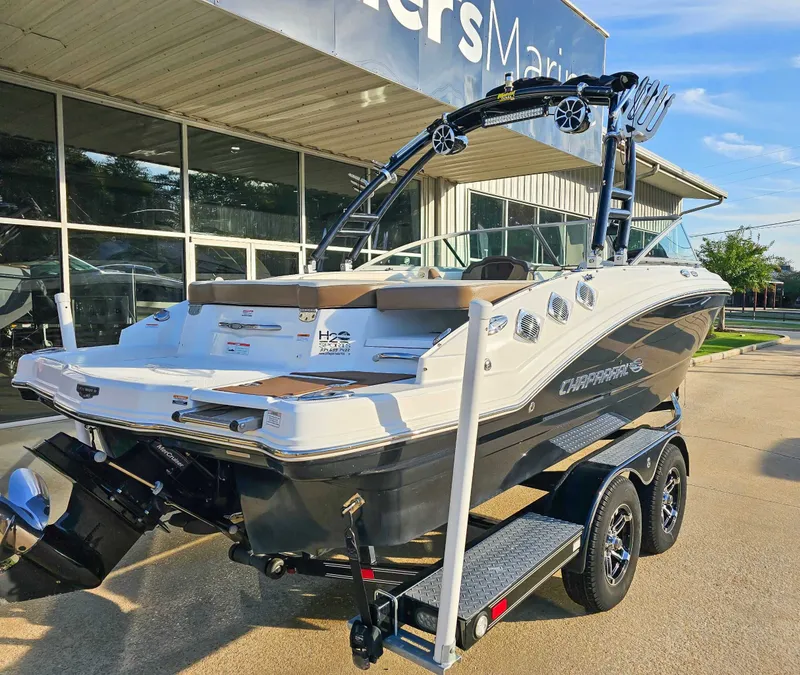 Slide: The Image of 2017 Chaparral 216 SSi boat on trailer outside a building. - 8