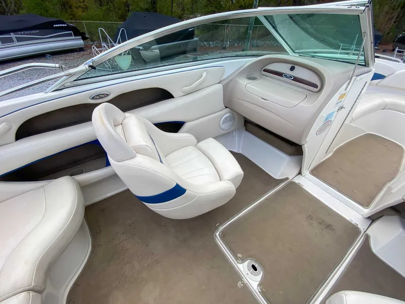 Slide: The Image of Interior of a 2000 Chaparral 216 SSi boat with white leather seats. - 14
