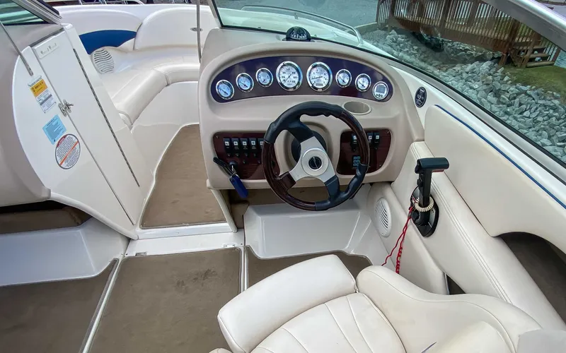 Slide: The Image of Interior of a 2000 Chaparral 216 SSi boat with steering wheel and dashboard. - 15