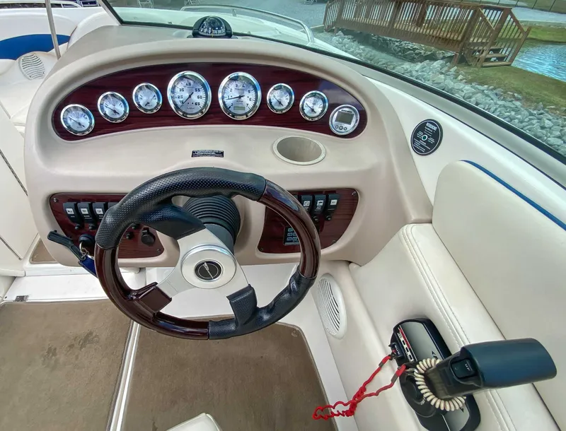 Slide: The Image of Interior view of 2000 Chaparral 216 SSi boat dashboard. - 16