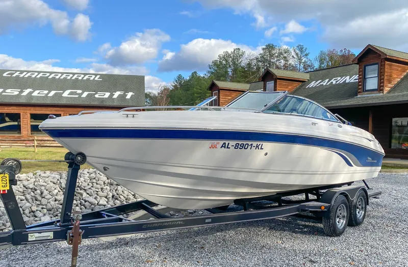 Slide: The Image of 2000 Chaparral 216 SSi boat on trailer in front of building. - 5