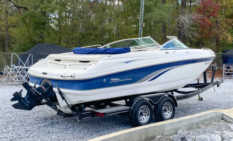 Slide: The Image of 2000 Chaparral 216 SSi boat on trailer outdoors. - 8