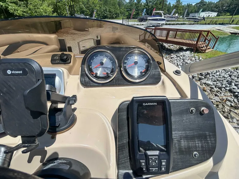 Slide: The Image of Dashboard of a 2014 Sweetwater 200 Premium Edition boat with Garmin device. - 14