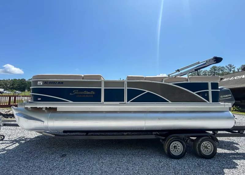 Slide: The Image of 2014 Sweetwater 200 Premium Edition pontoon boat on trailer. - 4