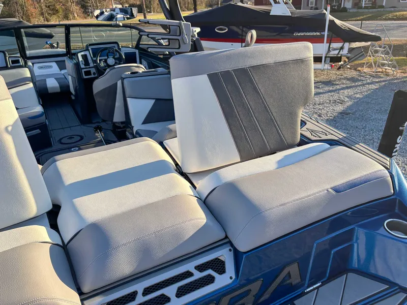 Slide: The Image of Interior of a 2020 Supra SA450 boat with beige seating. - 11