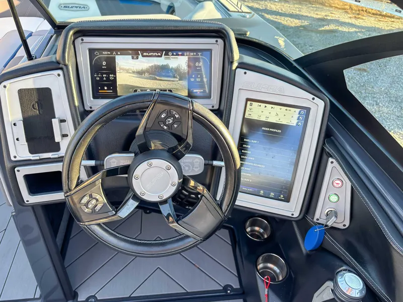 Slide: The Image of 2020 Supra SA450 steering console with touchscreen displays. - 18