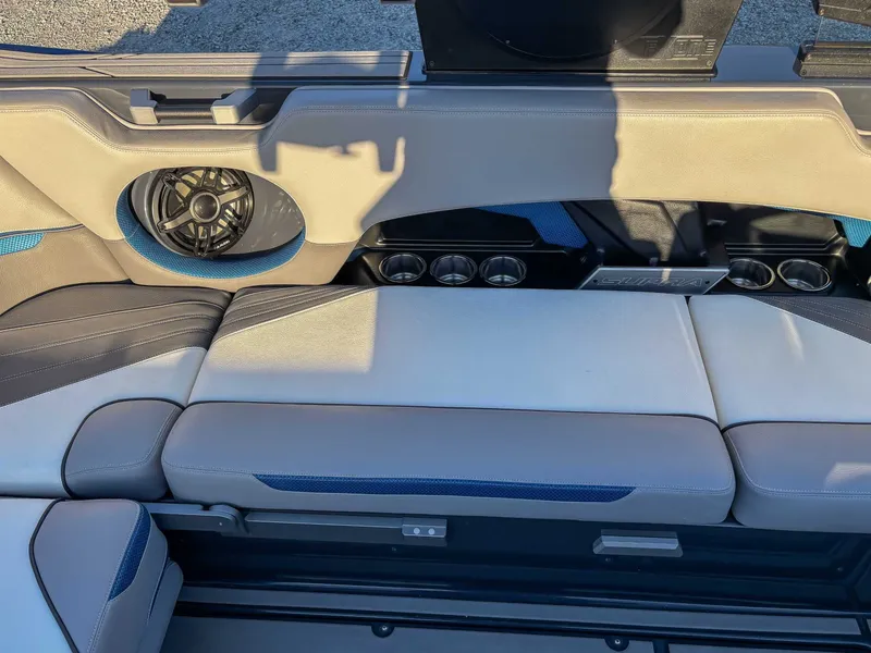 Slide: The Image of Interior of a 2020 Supra SA450 with speaker and seating area. - 20