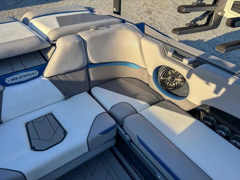 Slide: The Image of Interior of a 2020 Supra SA450 boat with speaker and seating. - 23